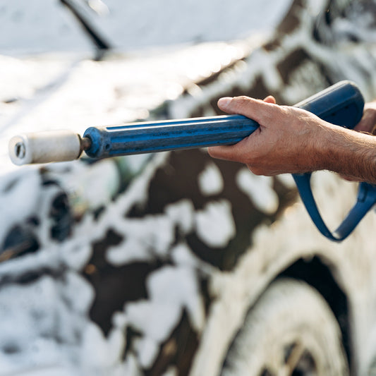 cropped view of the caucasian young man holding hose